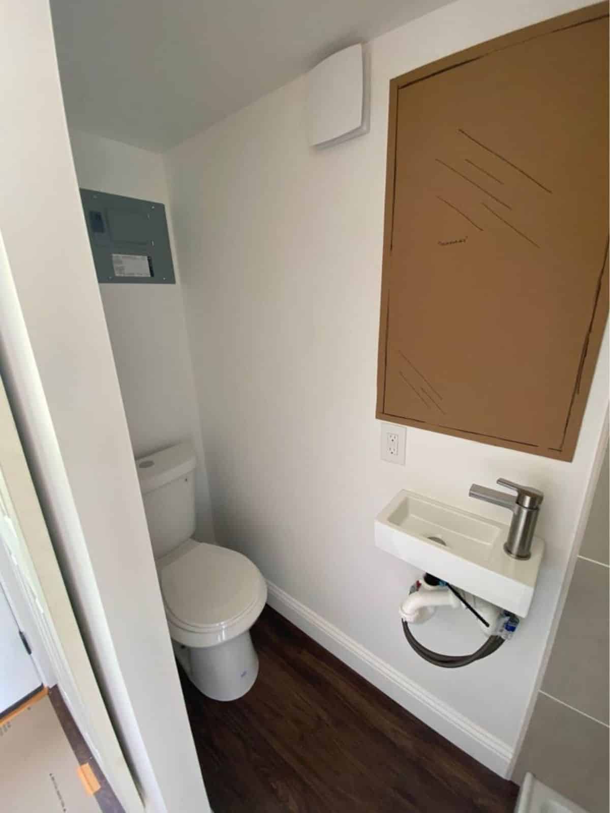 Standard toilet and sink with mirror