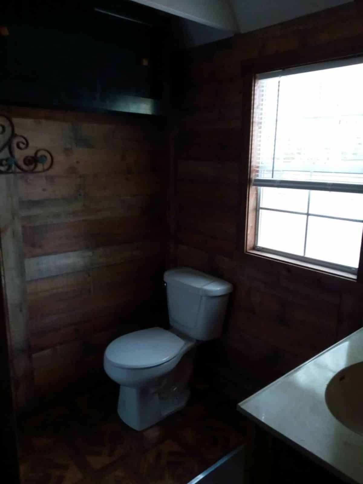 Bathroom of Tiny Home With Lofts has all the standard fitings