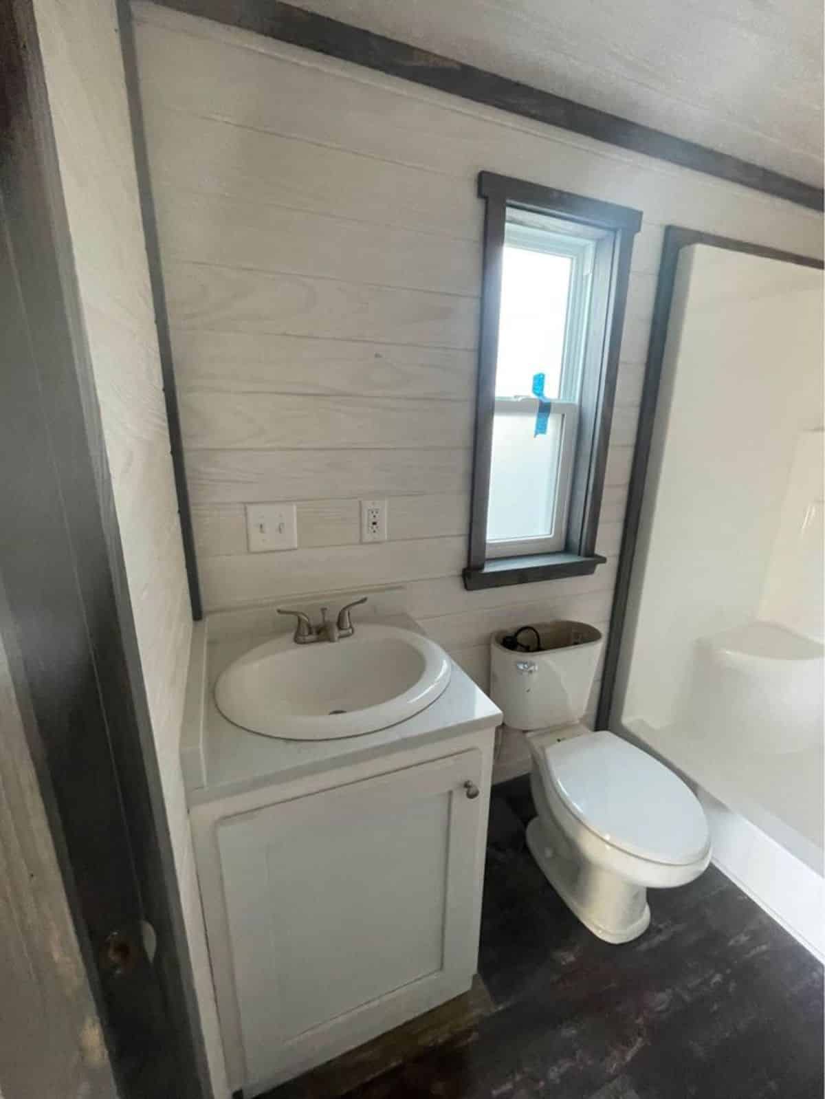 Bathroom of tiny luxury home has all the standard fittings