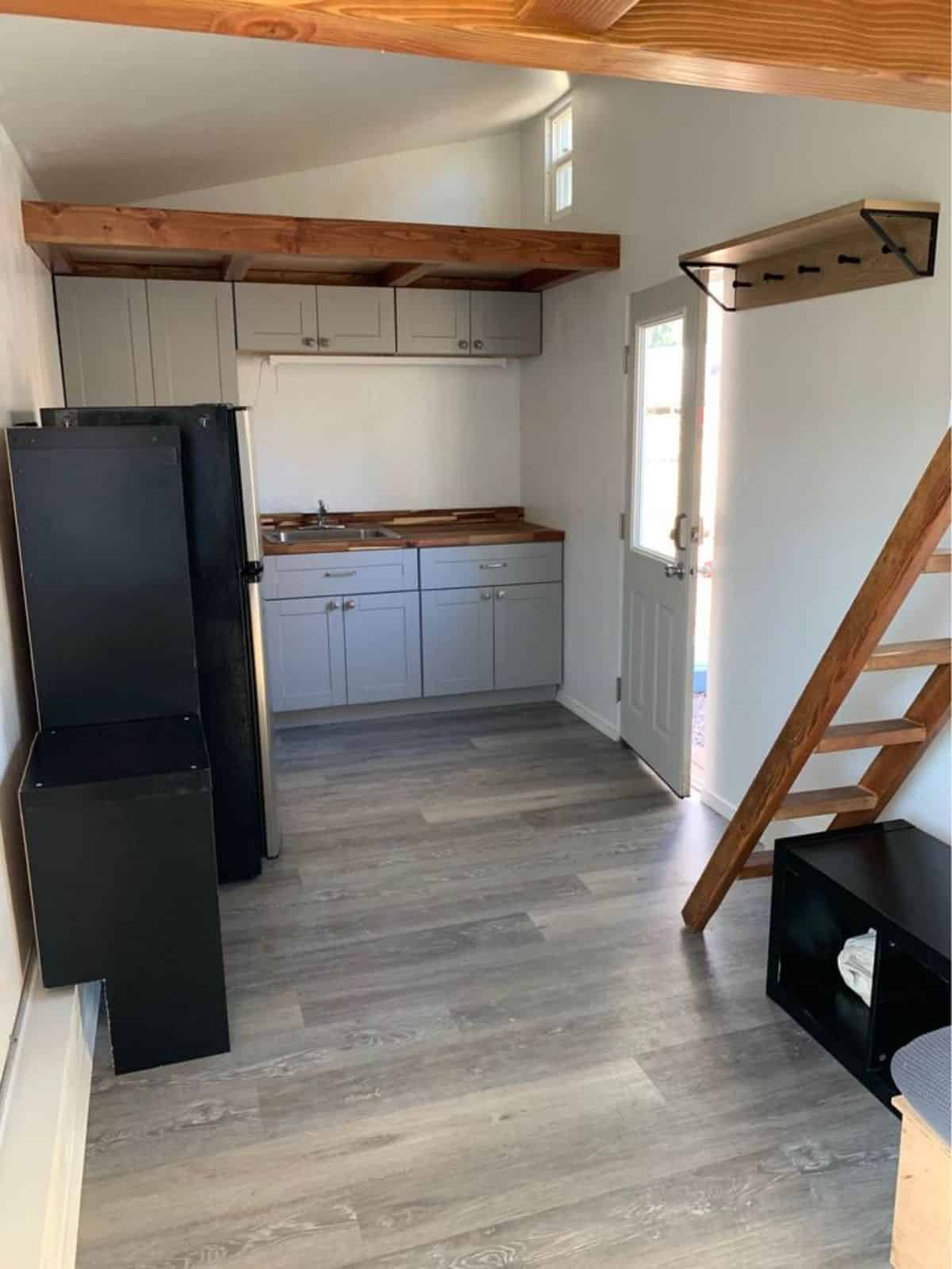 L shaped kitchen area of trailer built tiny house