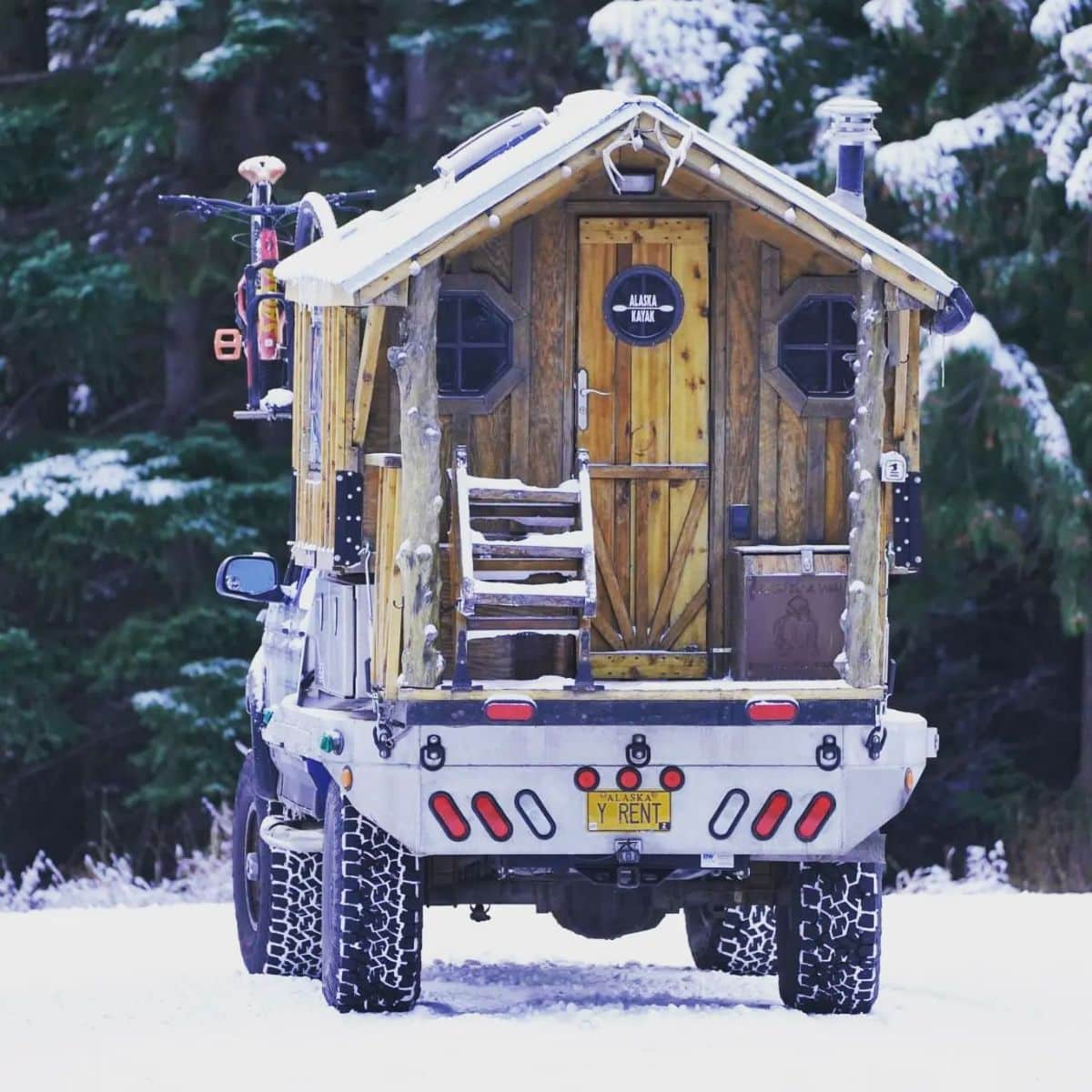 back porch and opening to tiny house truck in the snow