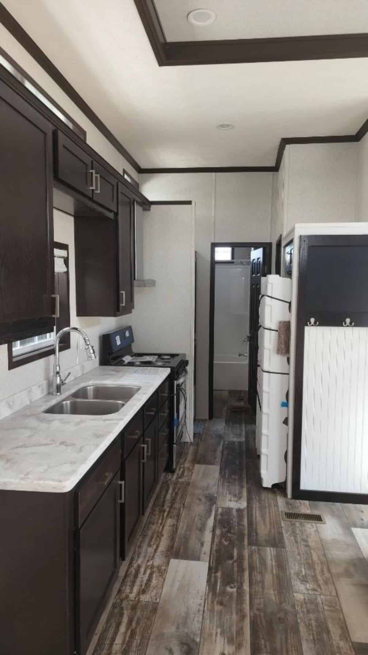 Well organized kitchen area of two bedroom tiny home