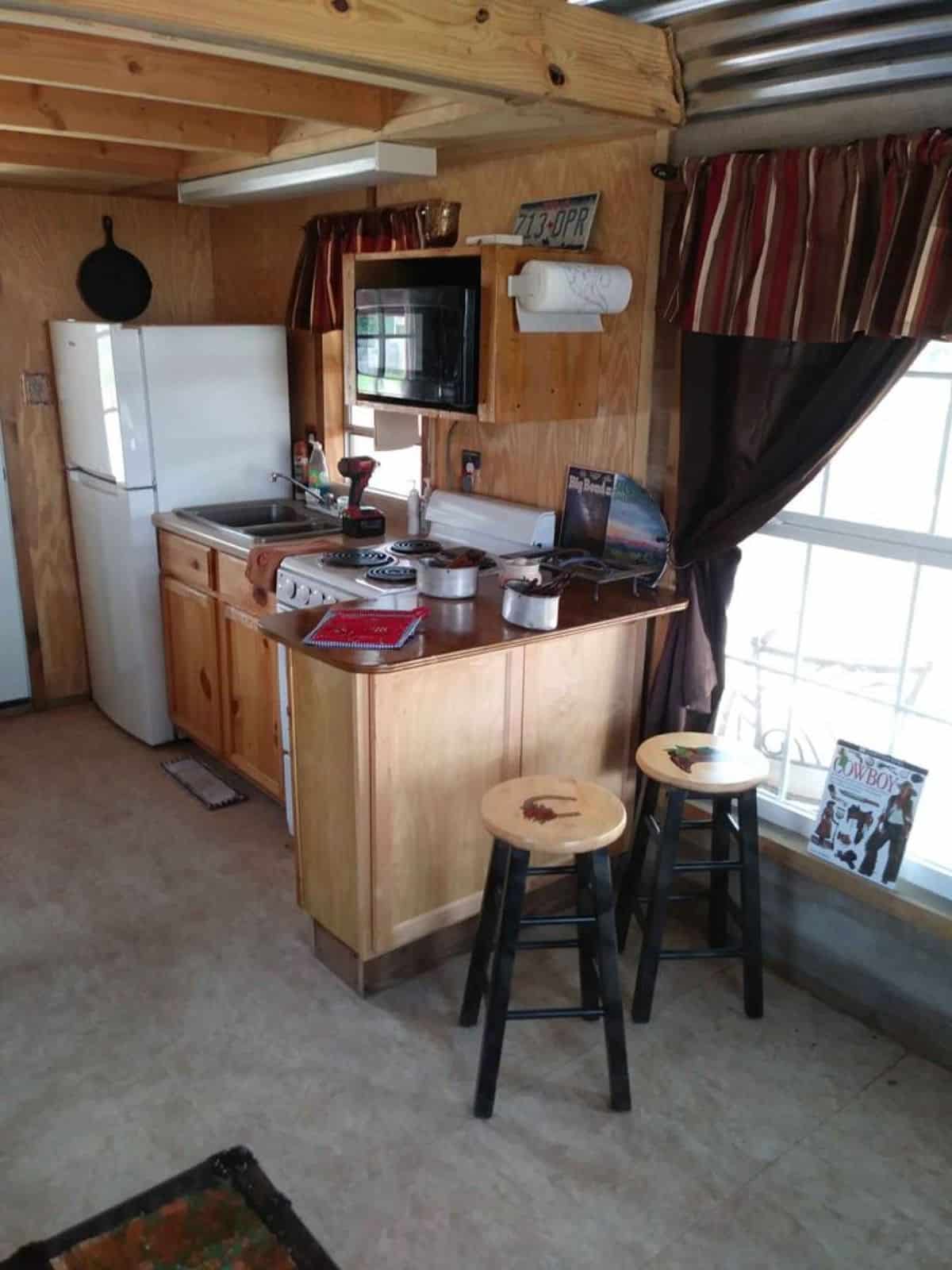 L shaped kitchen area of well insulated tiny house