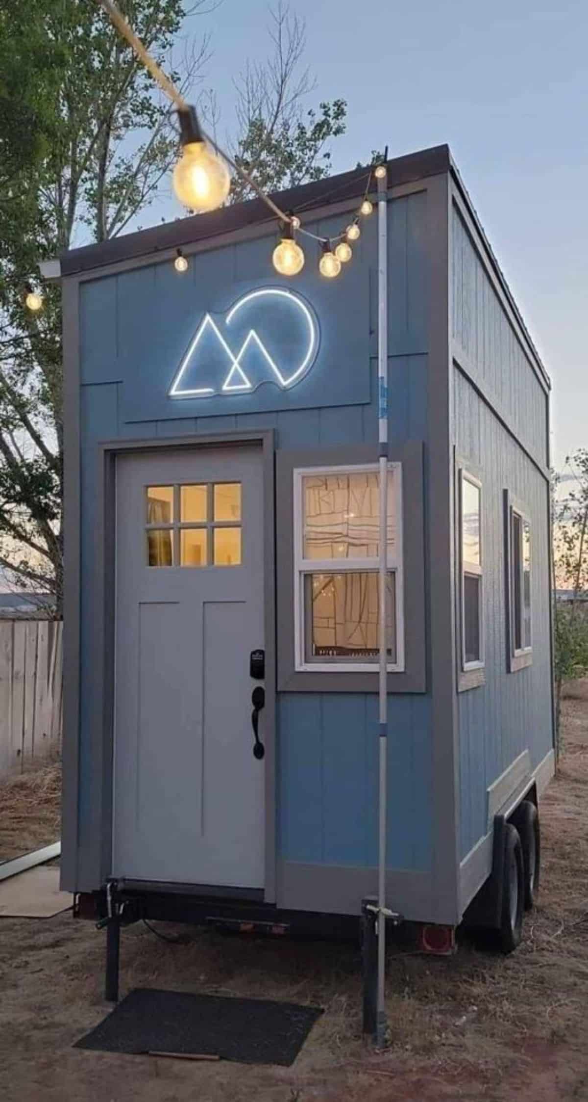 Main entrance view of 14’ compact tiny house