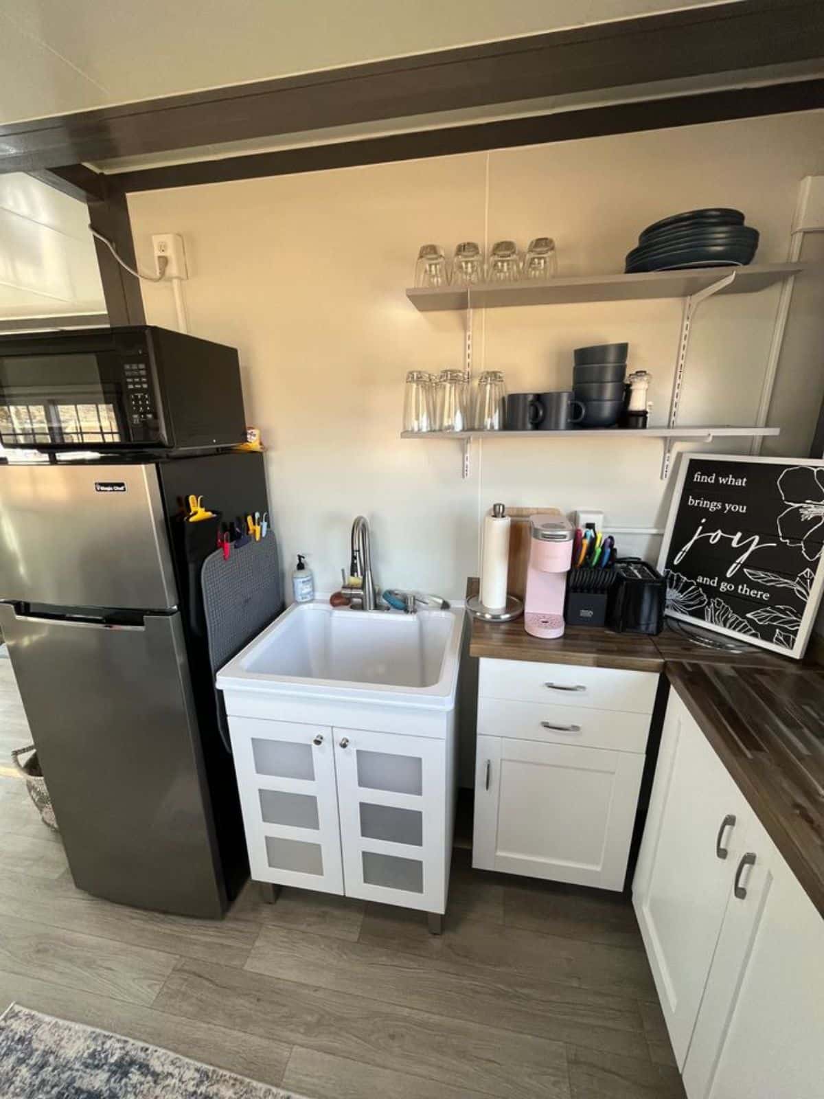 Kitchen area of 20’ unique tiny home with all the necessary appliances