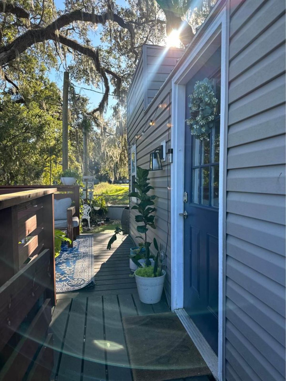Main entrance door view of tiny home with two lofts