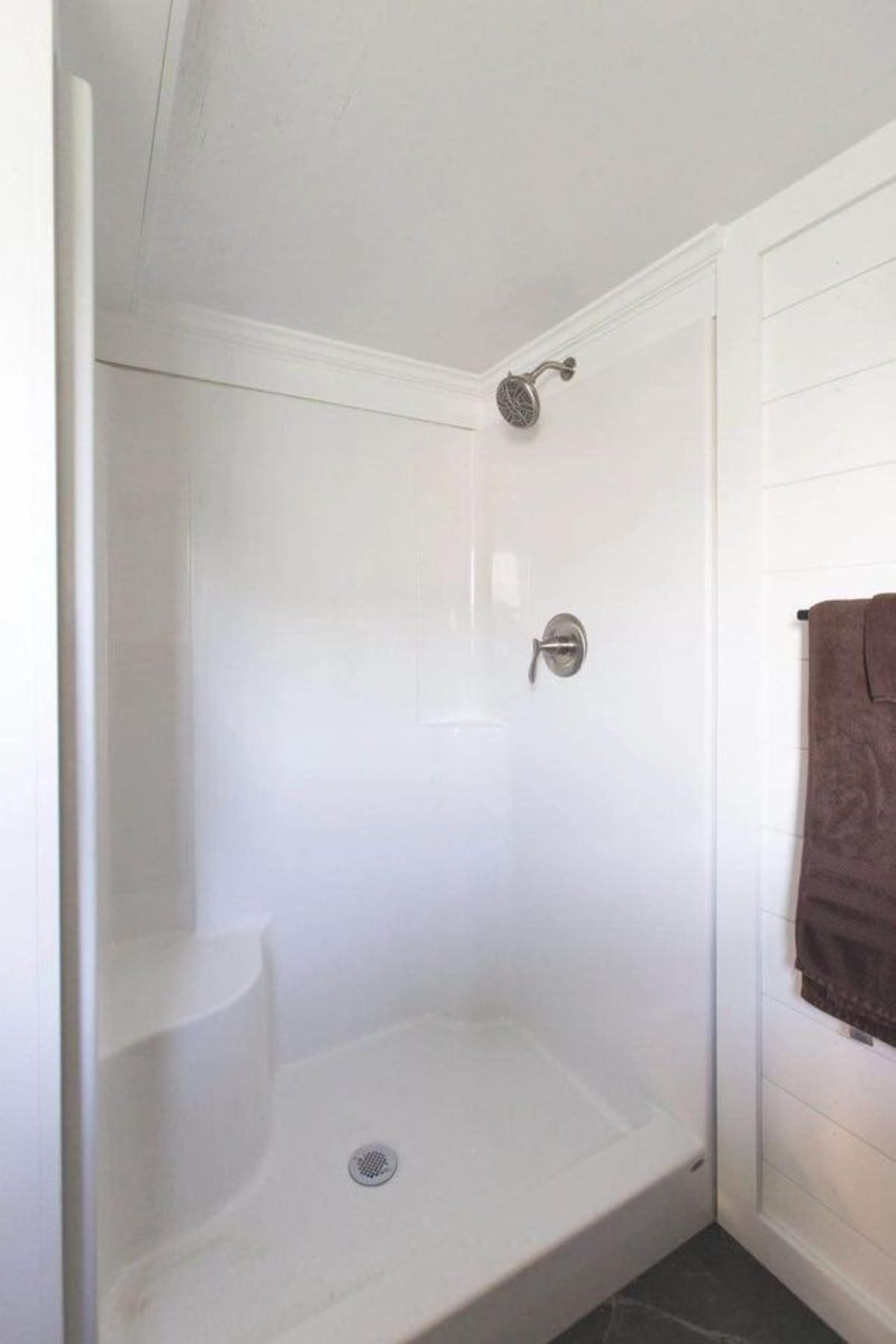 Separate shower area in bathroom of one bedroom tiny home