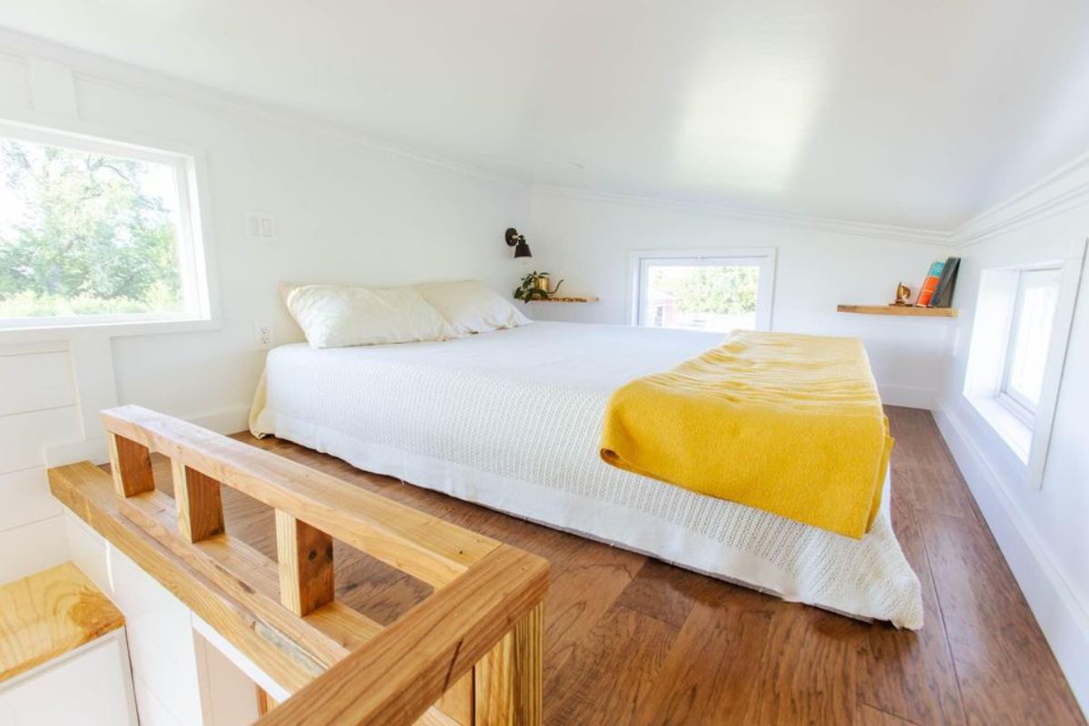 Queen mattress on the loft bedroom of one bedroom tiny home