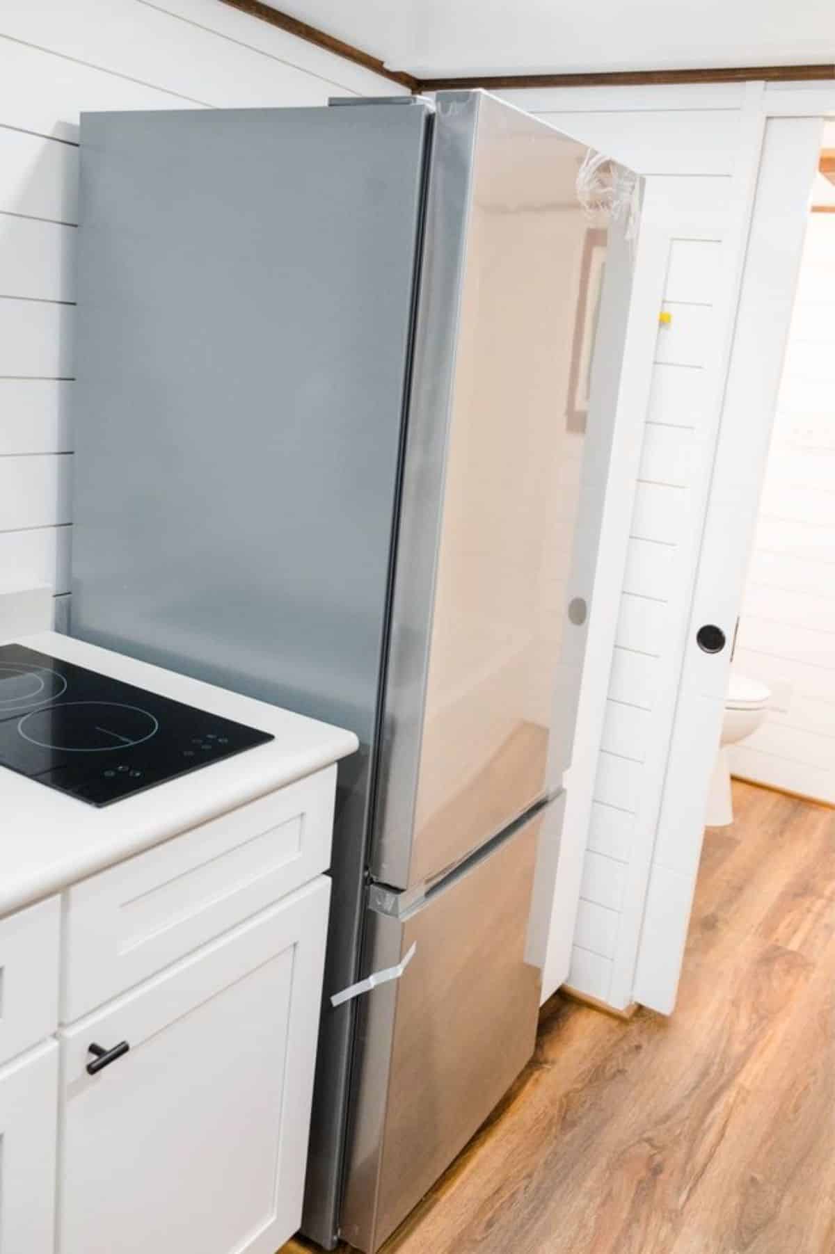 Double door refrigerator and other kitchen appliances are included in the deal