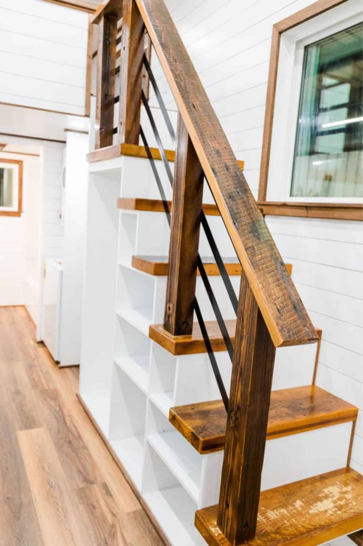 Multi purpose stairs leading to the big loft of 34’ custom built tiny home