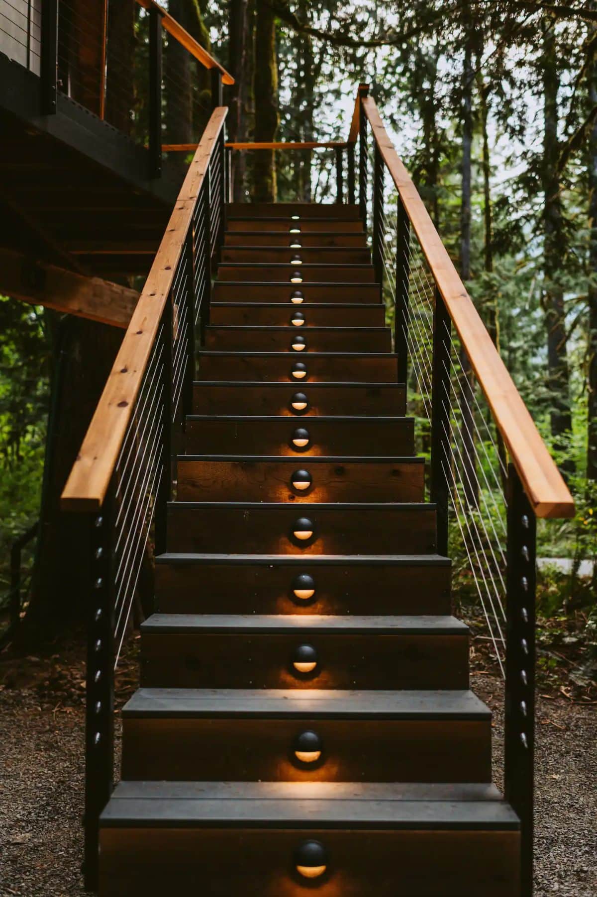 stairs leading to aframe with lights along the center