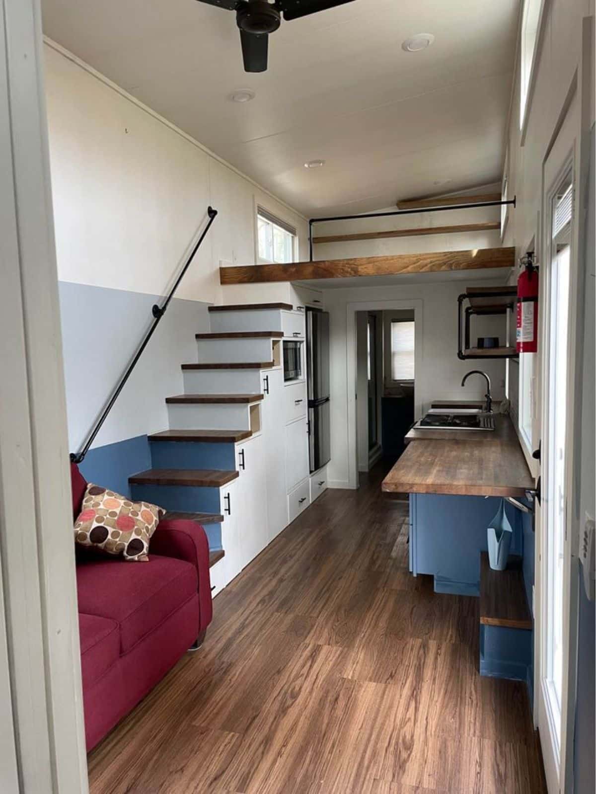 Multi purpose stairs leading to the loft bedroom of beautiful and modern tiny home