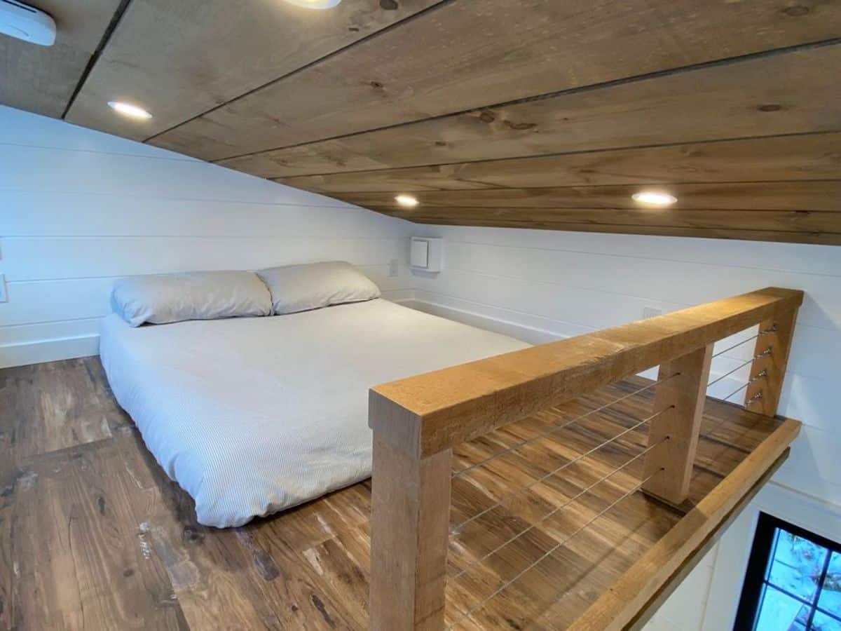 Loft bedroom is very spacious with ample space left after the king mattress