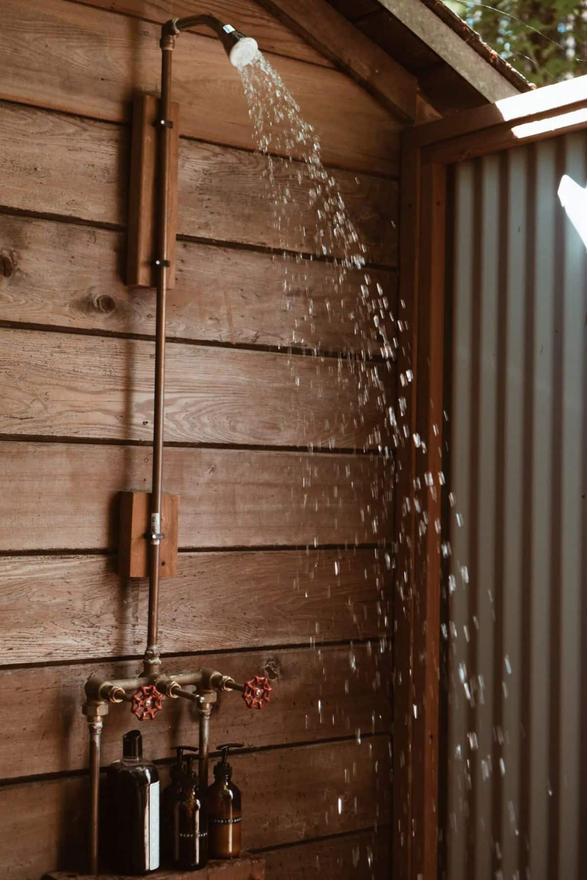 outdoor shower with wood panel background