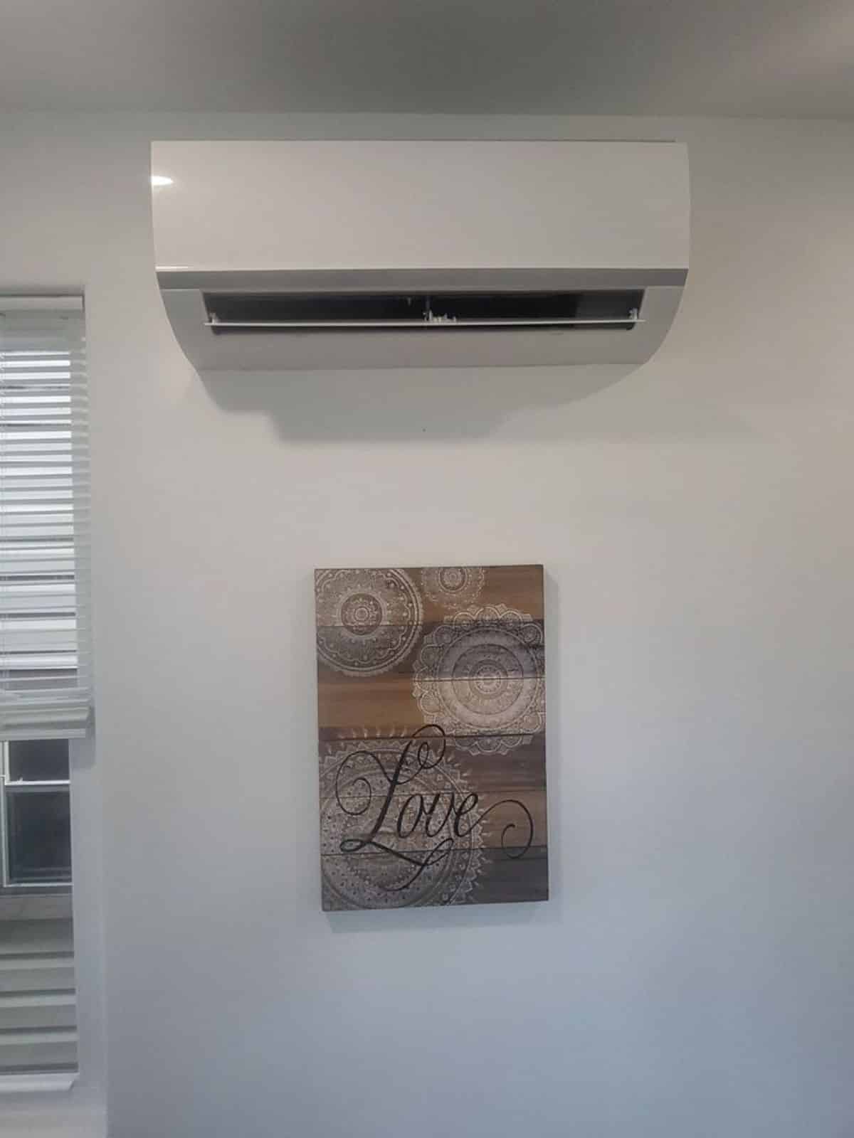 Air condition unit is installed in living area of comfortable tiny home