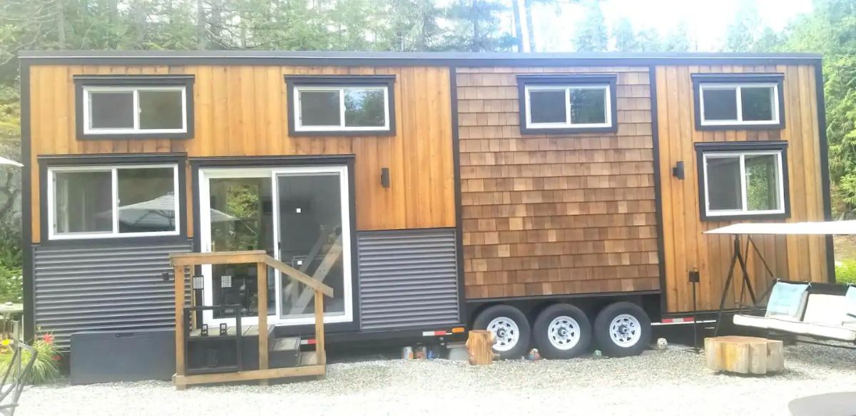 wood grain with gray siding on outside of tiny home