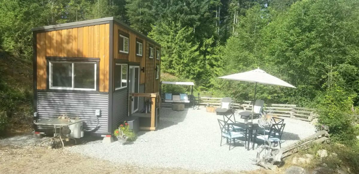 tiny home with large patio area and covered picnic table