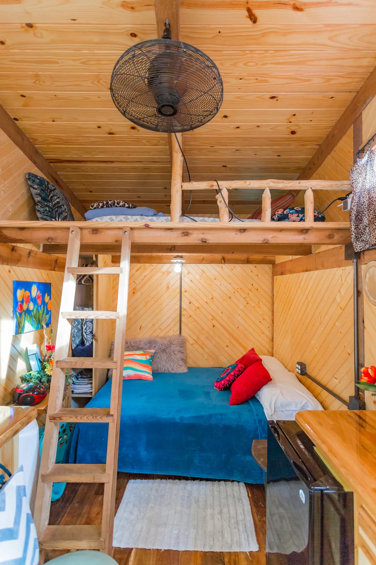Two double beds, one at ground level and one in bunk accessible via ladder