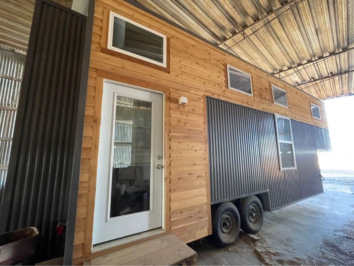 Main entrance and stunning exterior of rustic 30’ tiny house
