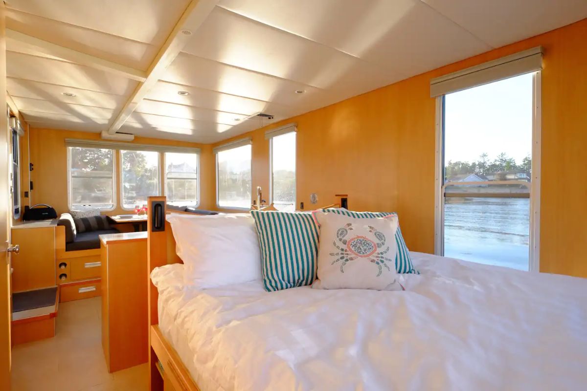 white bedding on tiny house boat bed
