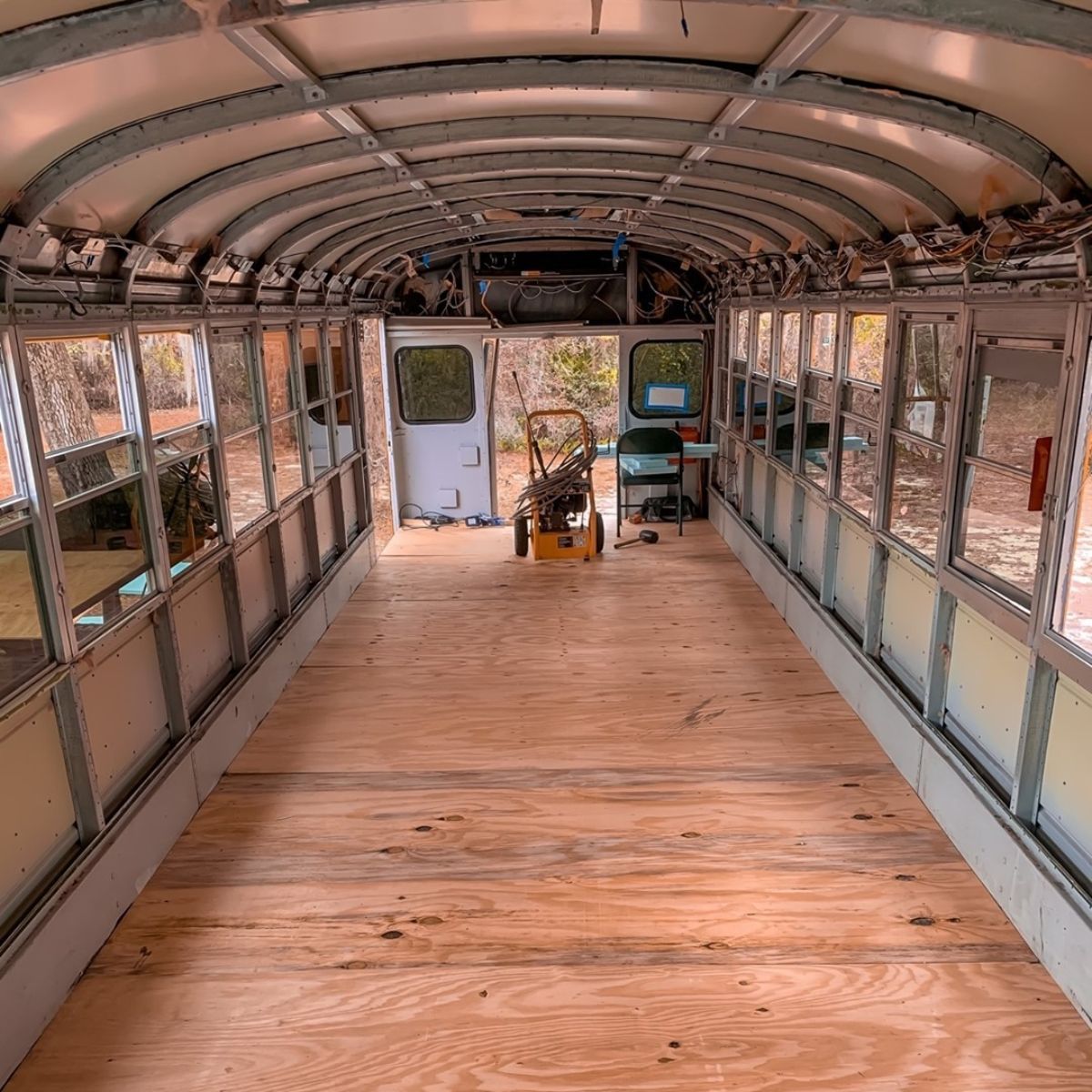 wood floor on base of tiny home bus