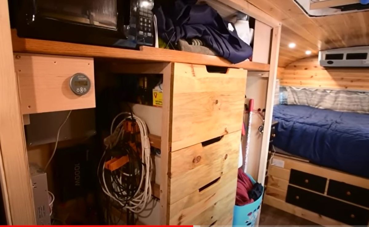 wood storage drawers with laundry below