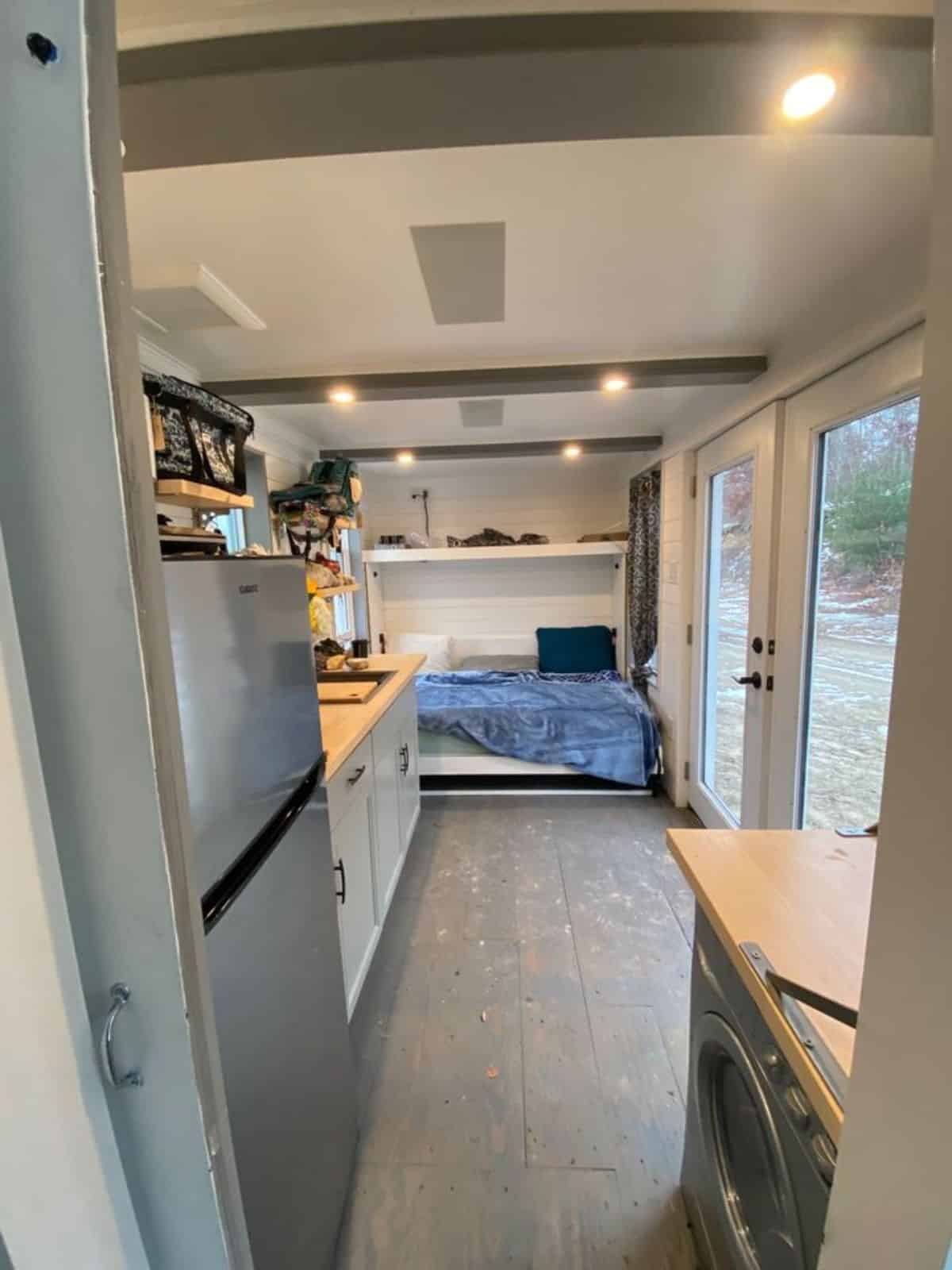 Murphy bed with storage at the end of solar powered tiny home