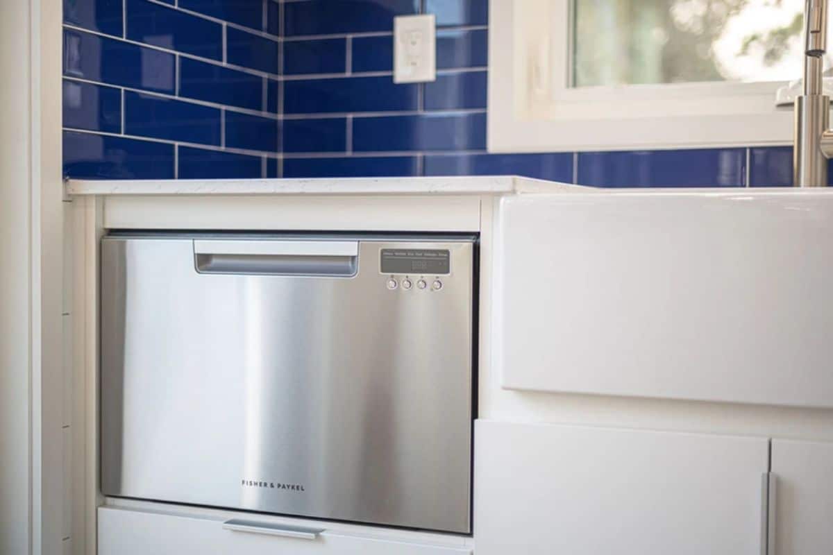 drawer stainless steel dishwasher under white cabinet