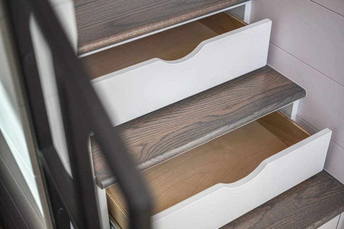 open drawers of steps by railing