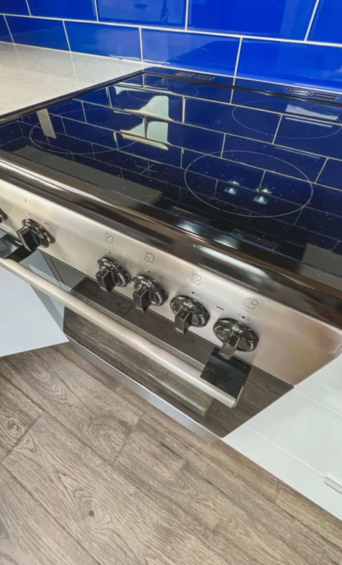 stainless steel stovetop in white countertop