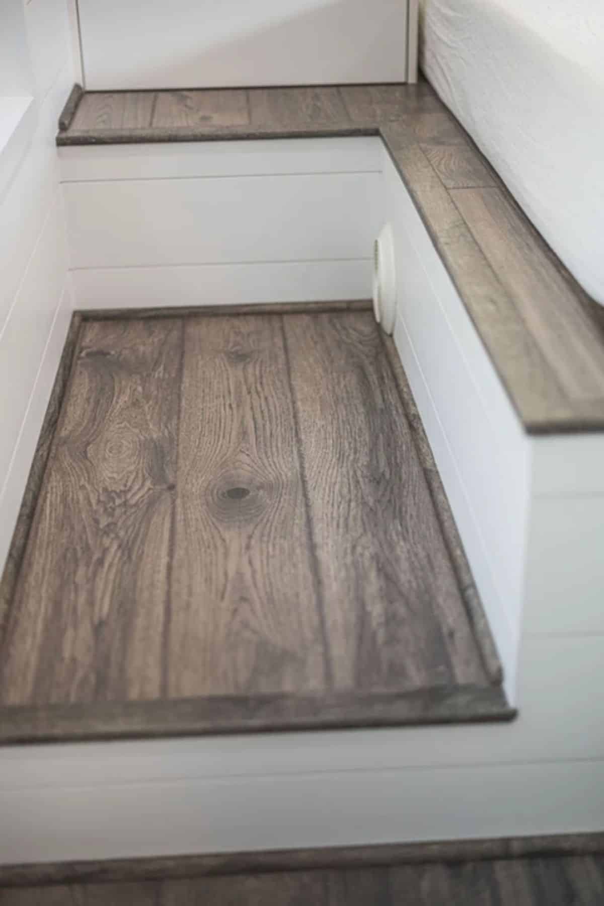 wood stair tops on white stais