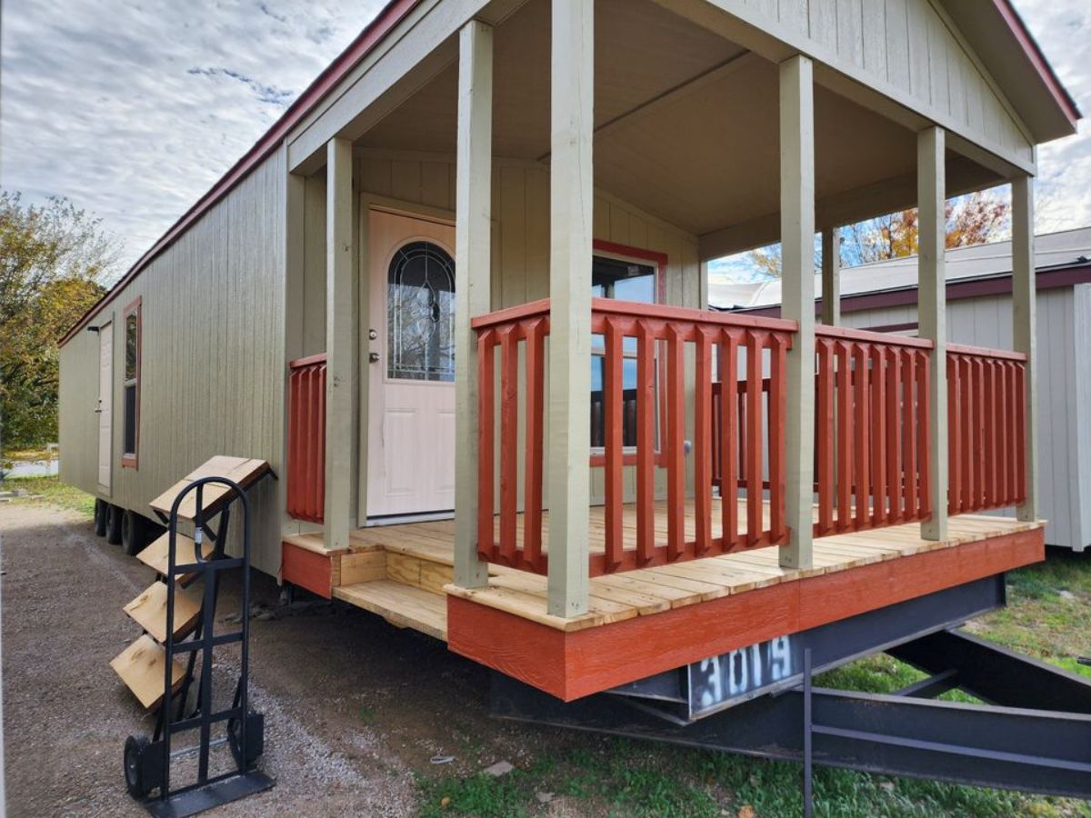 Huge porch outside the main entrance of one bath tiny house