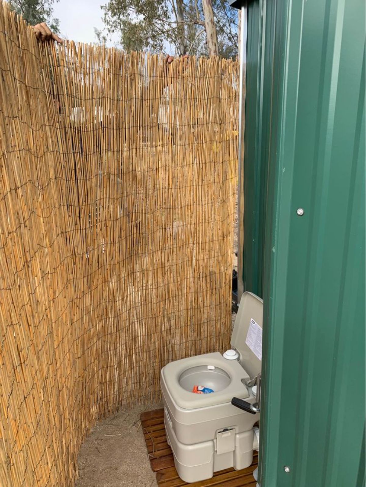 Compost toilet outside the trailer built tiny house
