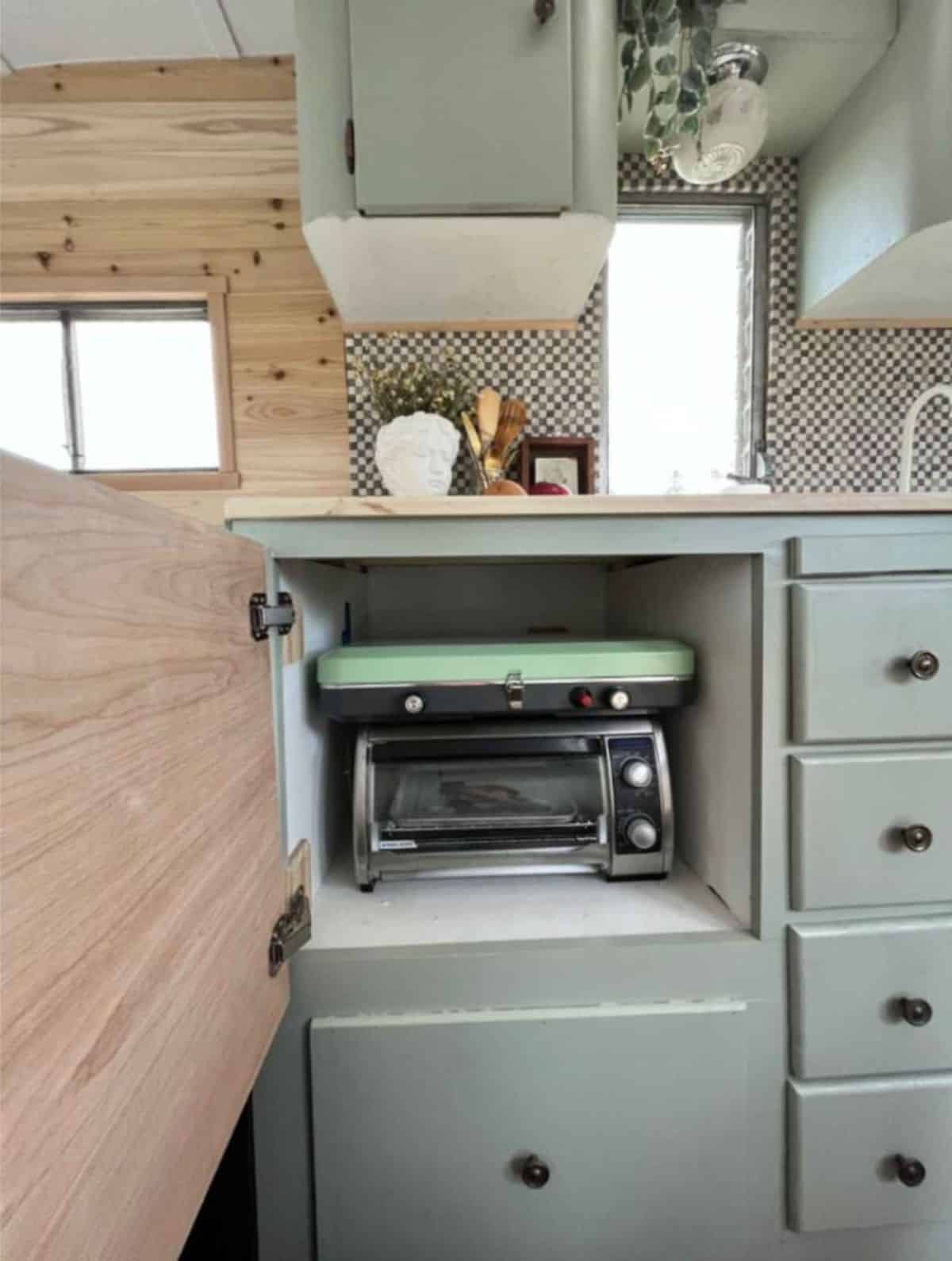 Microwave oven included in the kitchen of renovated tiny home