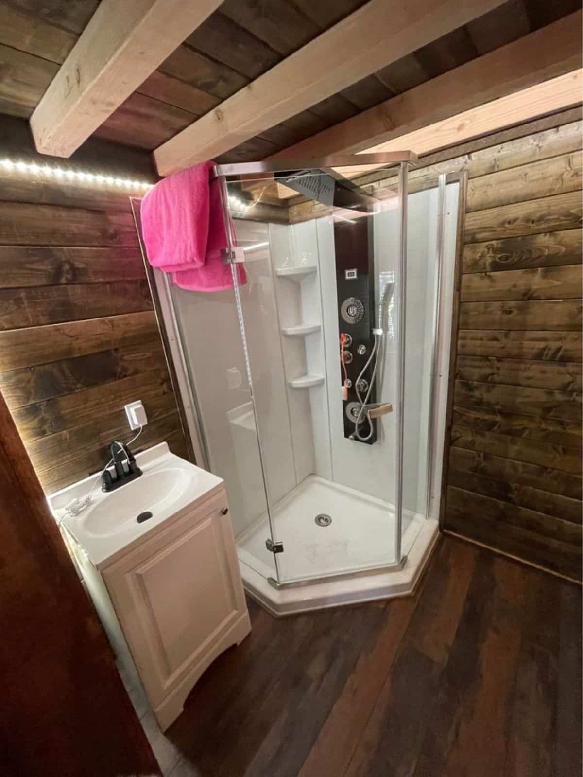 Stylish bathroom of wooden tiny home