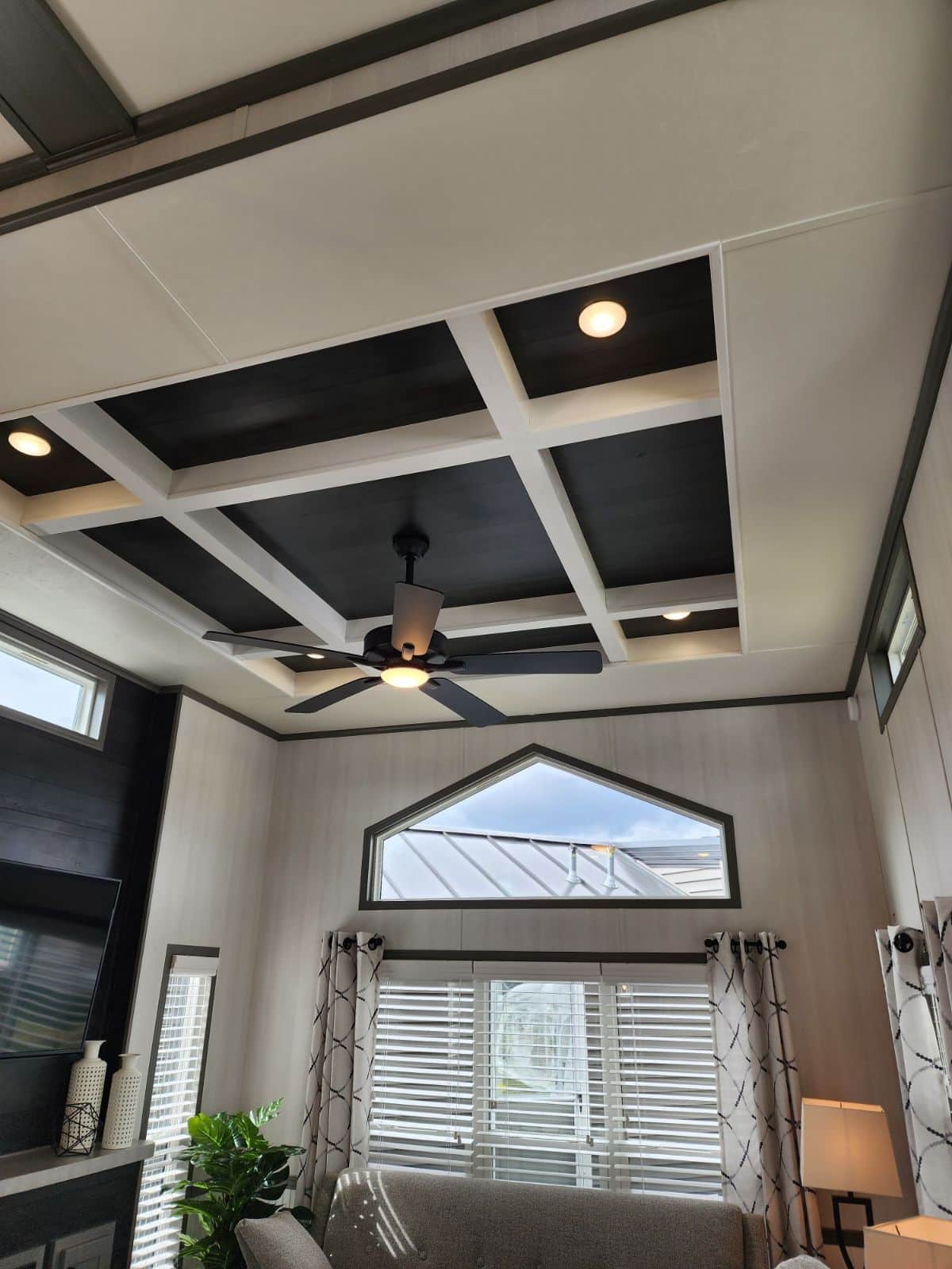 A ceiling in a living room of a tiny house.