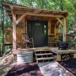 Ray’s Cabin is an Off-the-Grid Tiny House with a porch - outdoor view.