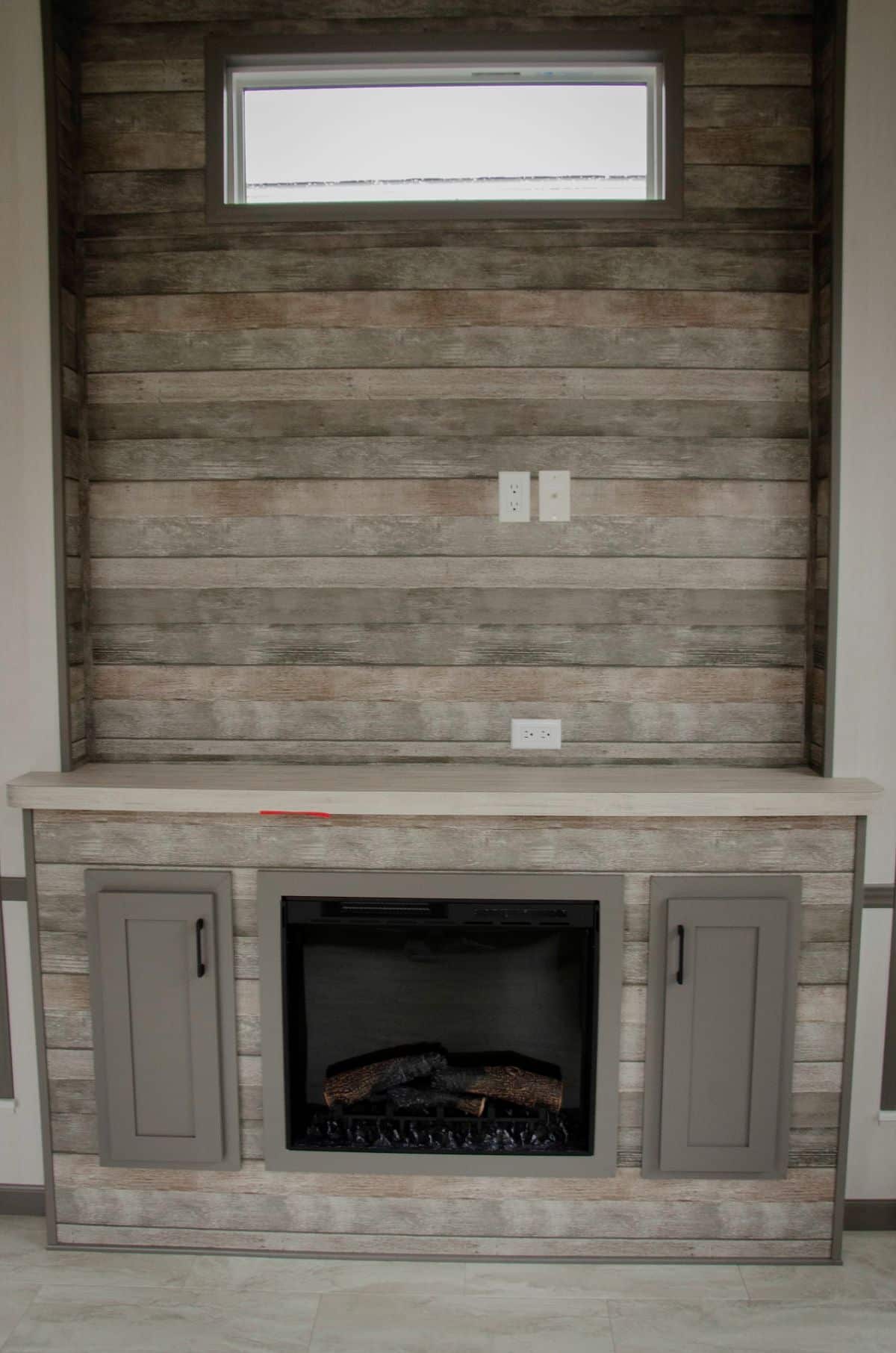 A modern-looking fireplace in a tiny house.