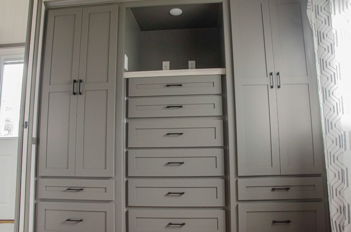 A gray cabinets in a tiny house.