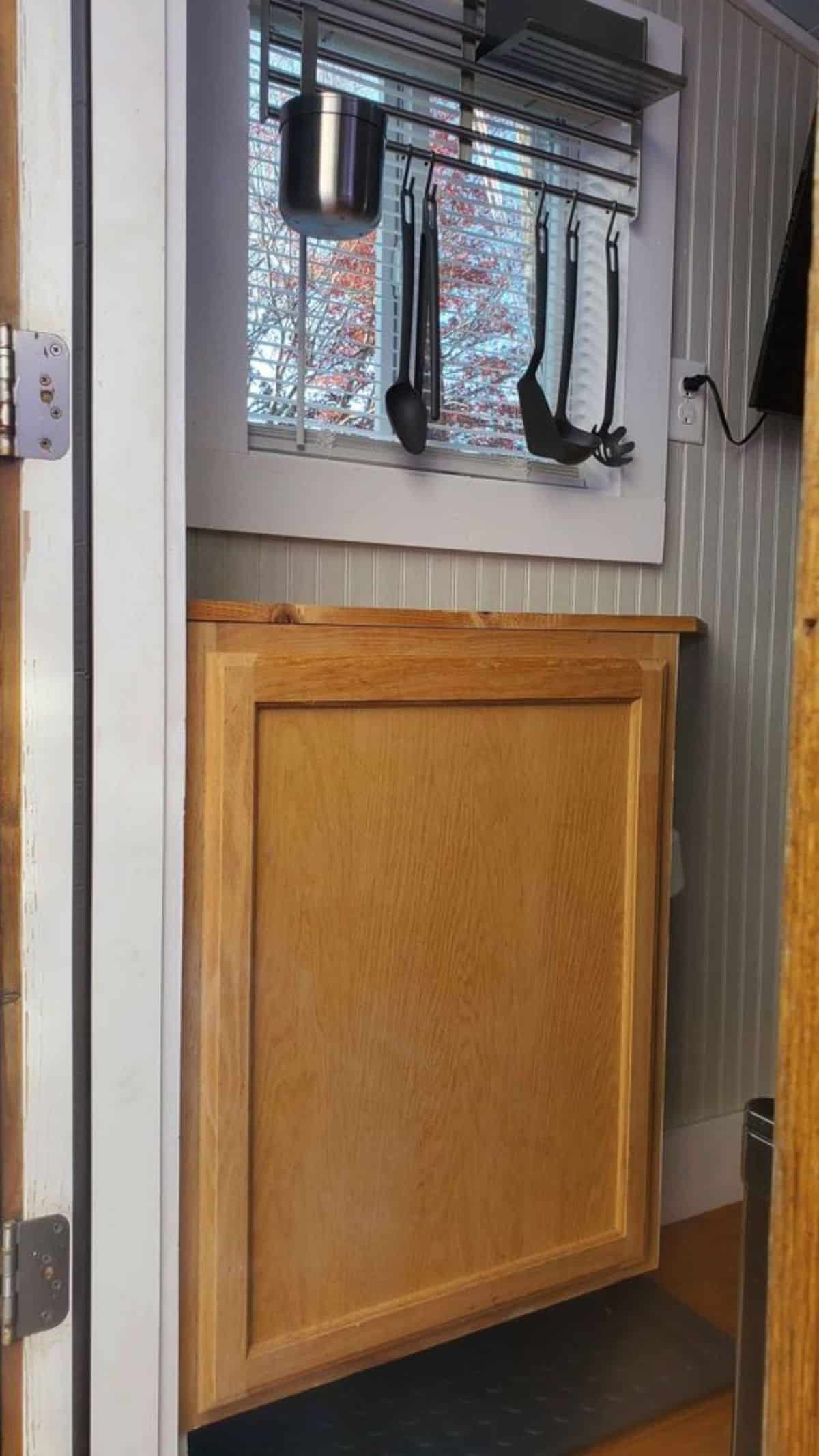 Storage cabinets in the kitchen of 10' all electric home
