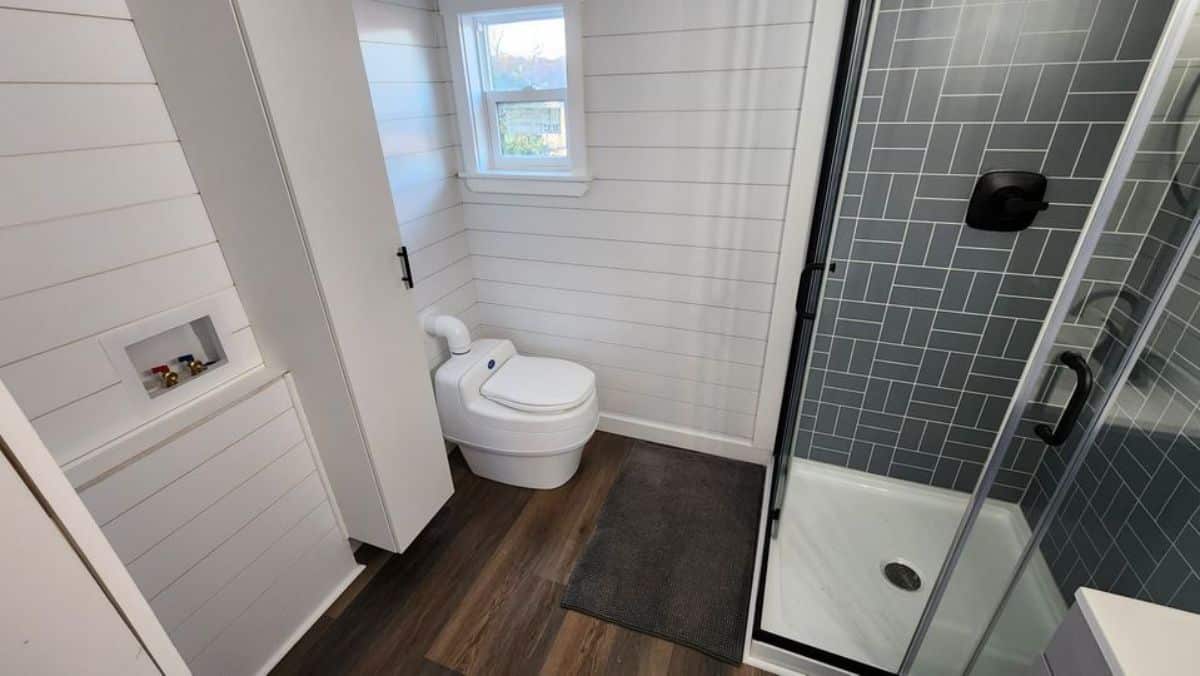 composting toilet in bathroom of 2 bedroom tiny home