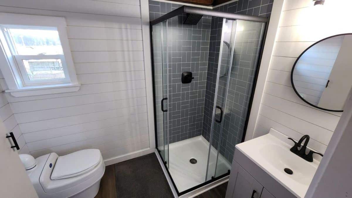 glass enclosure with separate shower area in bathroom