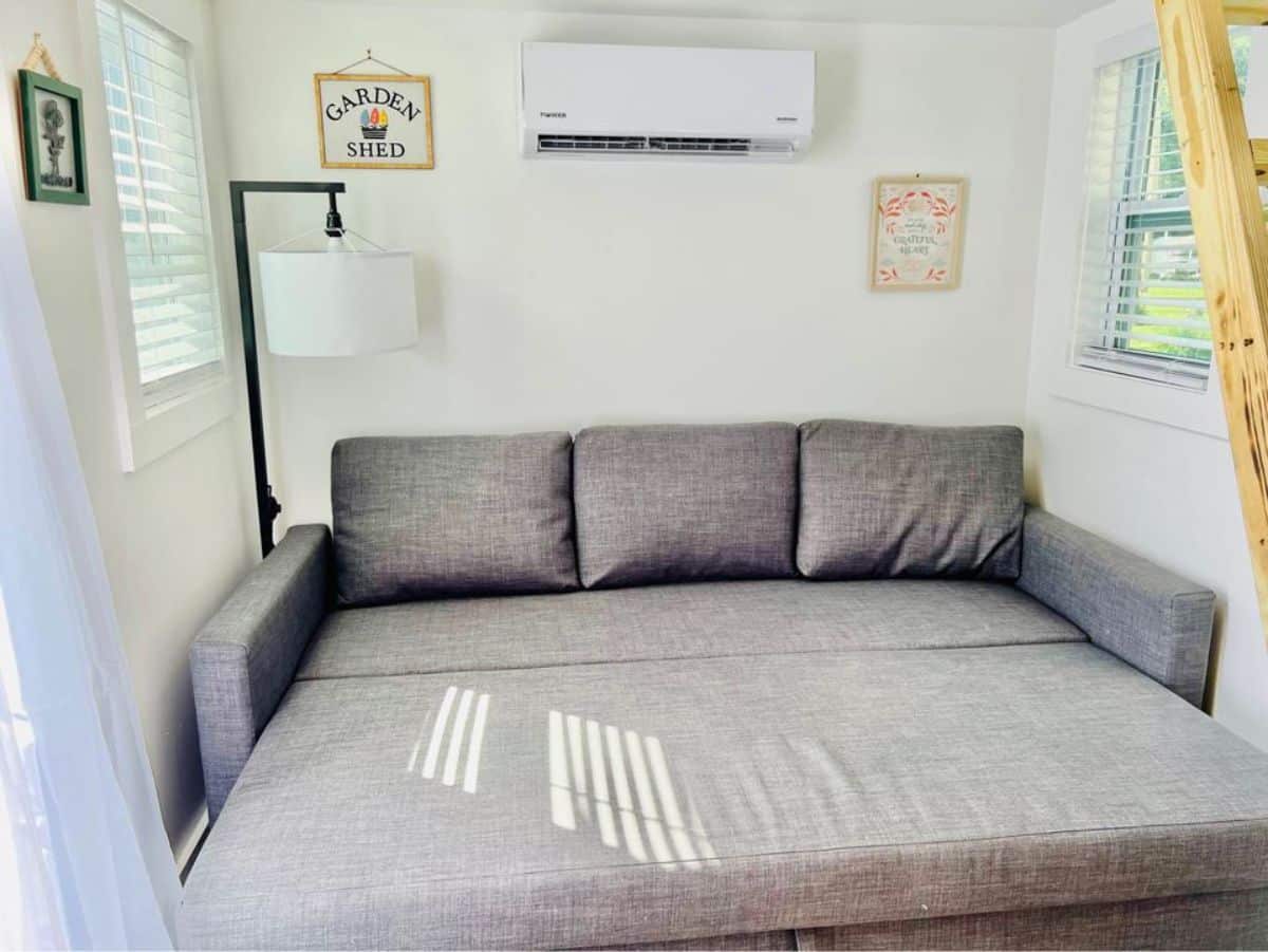 living area has a convertible sofa cum bed