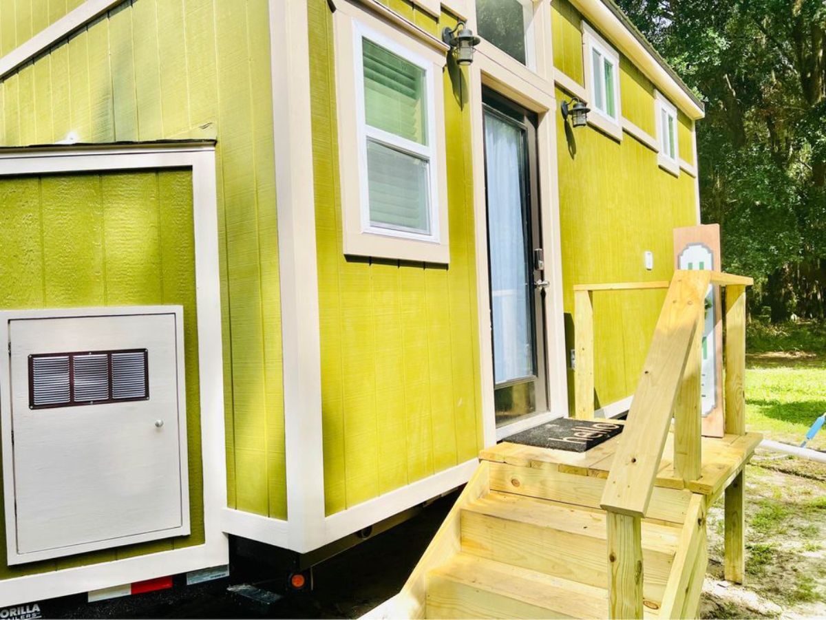 greenish yellow exterior of remodeled home on wheels