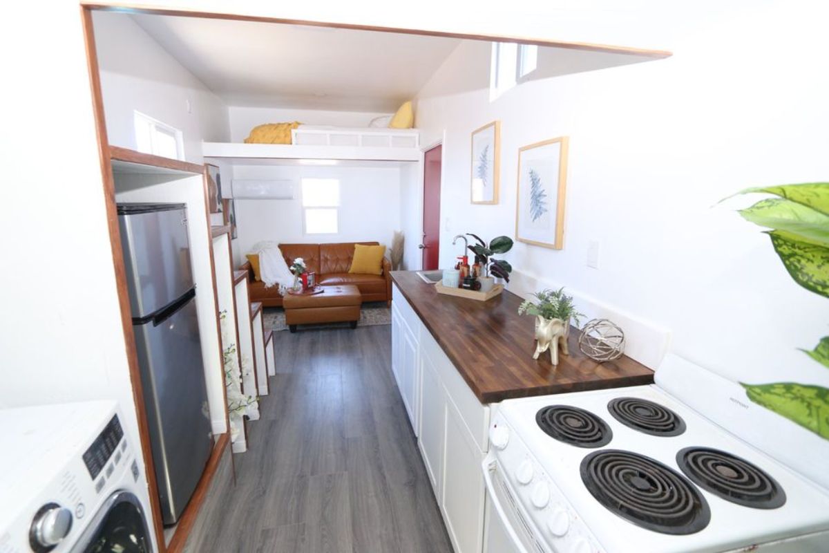 kitchen of dual loft tiny house has granite countertop