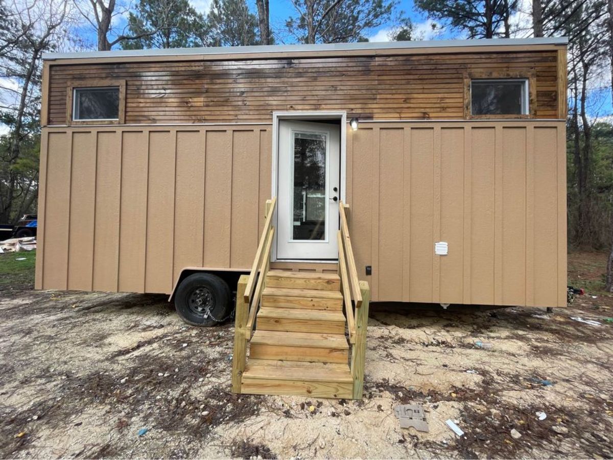 Main entrance cum brown exterior of 24’ tiny house on wheels