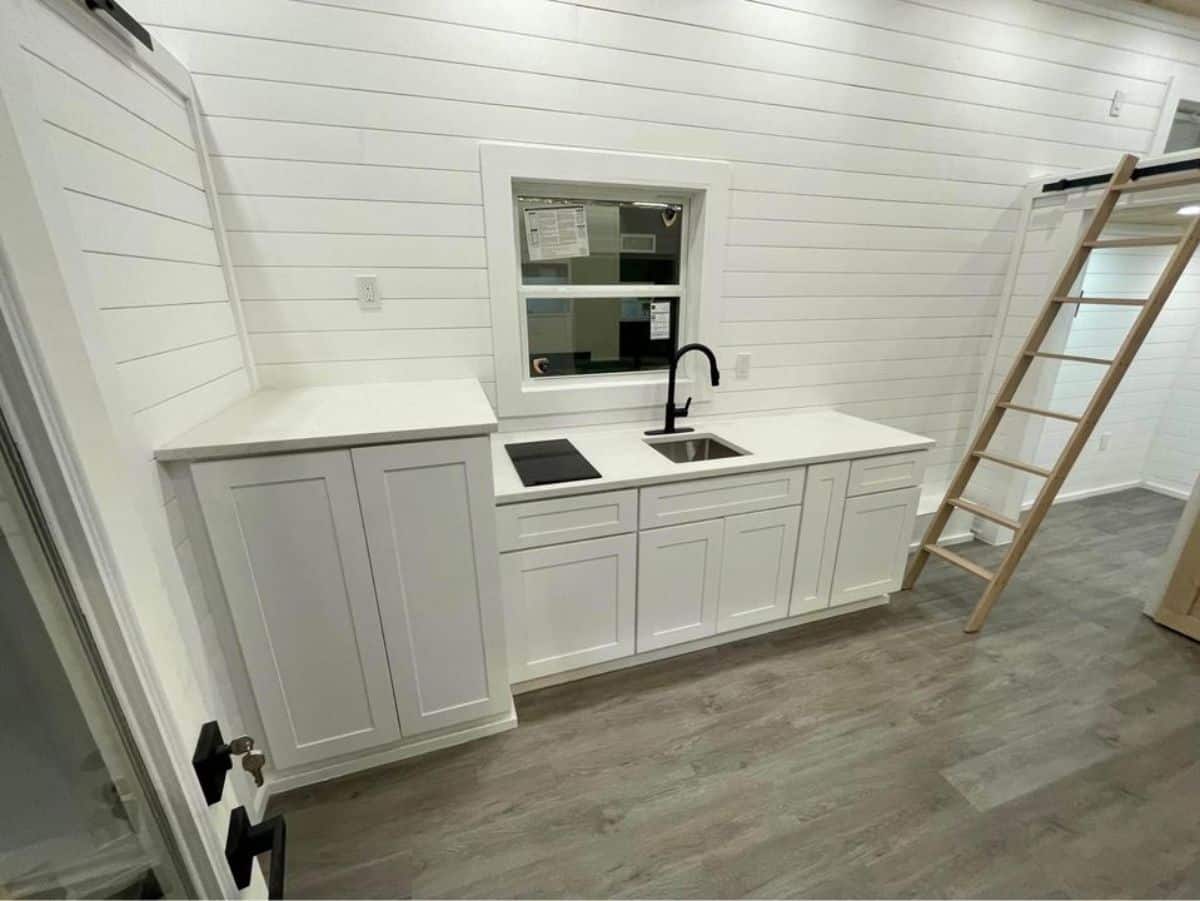 kitchen area of 24’ tiny house on wheels is decent