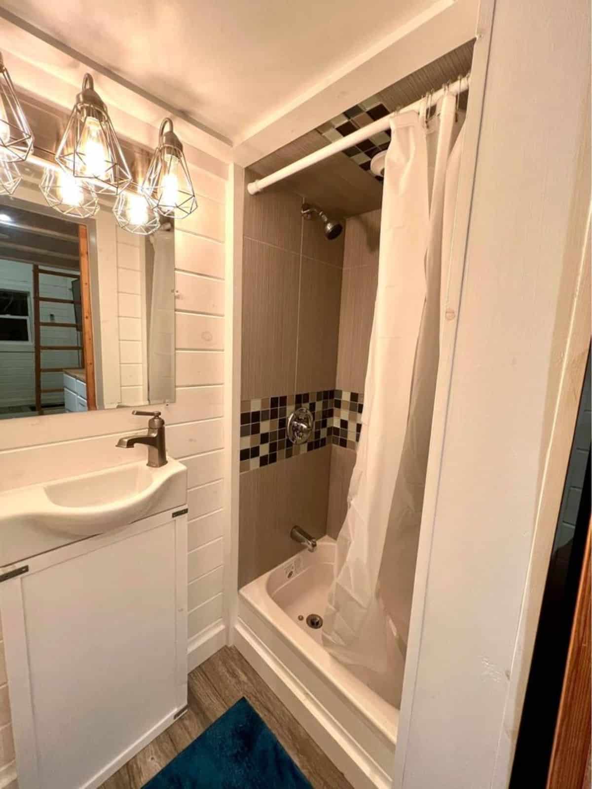 Shower with RV tub in bathroom of 240 sf tiny home