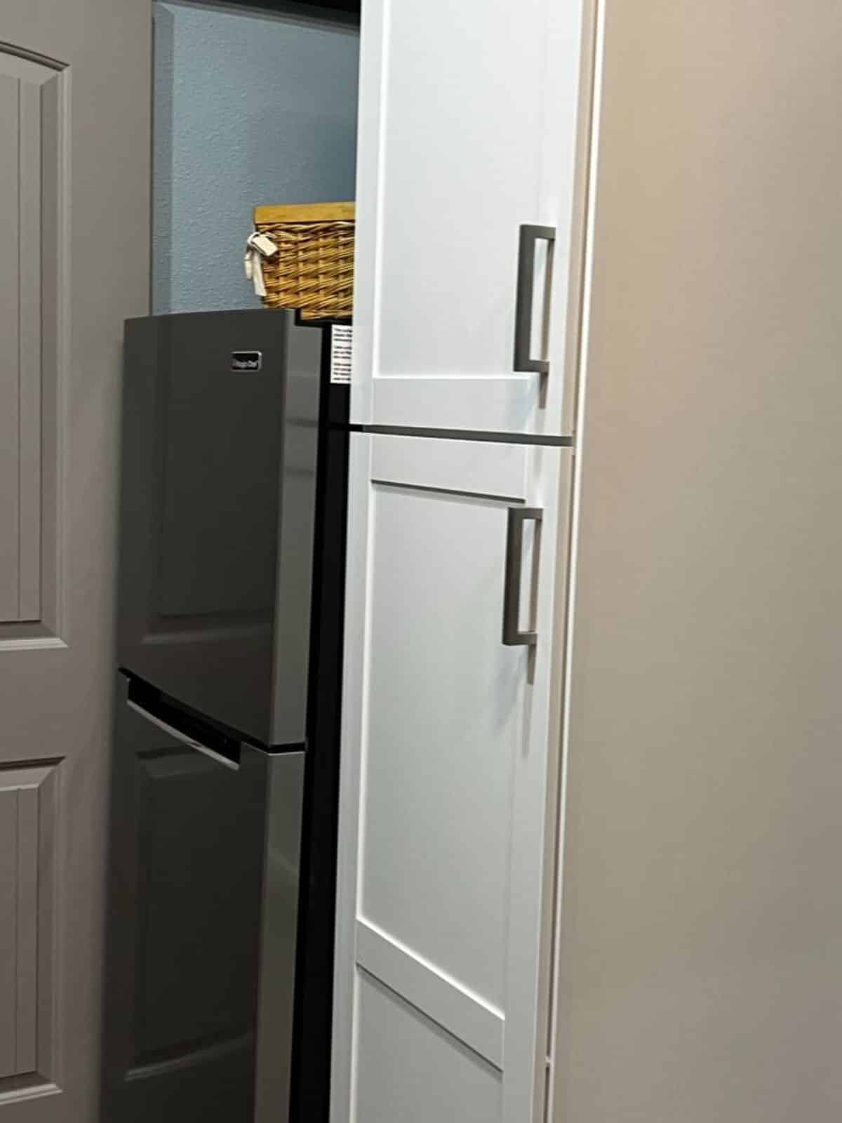 double door refrigerator with storage cabinets for pantry items