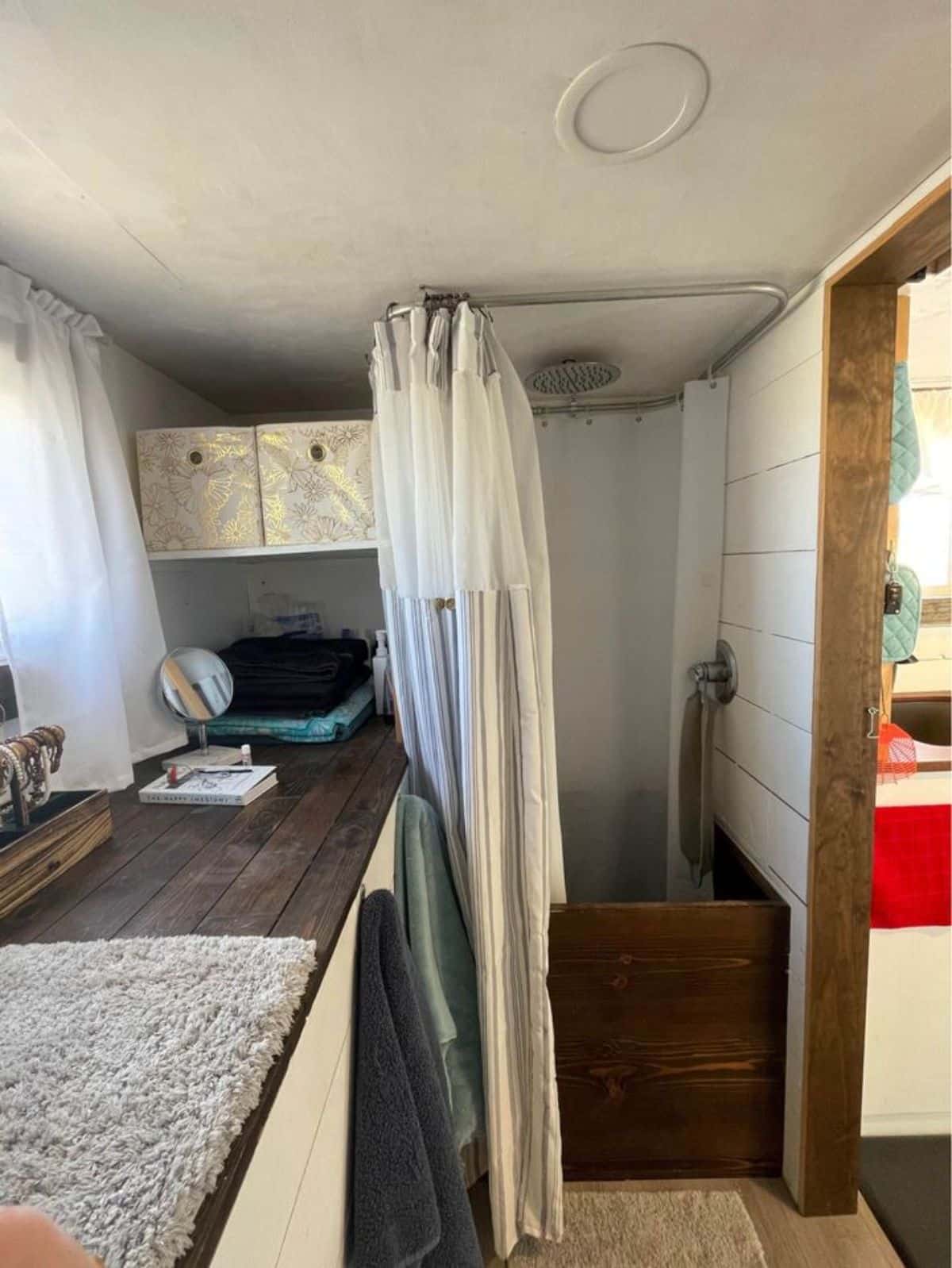 separate shower area in bathroom of tiny home for a couple